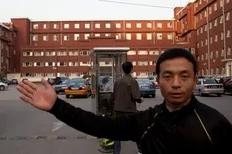 A plainclothes policeman stops the taking of photos outside the Chaoyang Hospital in Beijing where Chinese activist Chen Guangcheng was taken on May 2, 2012. Beijing pledged that the legal Chinese activist Chen Guangcheng -- who fled to the US embassy on April 22 -- and his family would...
