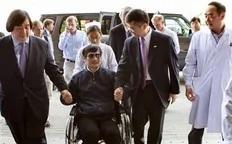 ADDS U.S. STATE DEPARTMENT LEGAL ADVISOR HAROLD KOH AT LEFT   In this photo released by the US Embassy Beijing Press Office, blind lawyer Chen Guangcheng is wheeled into a hospital by U.S. Ambassador to China Gary Locke, right, and an unidentified official at left, in Beijing Wednesday...