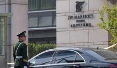 A paramilitary guard stands at the J W Marriott hotel in Beijing where US Secretary of State Hilary Clinton was staying on May 2, 2012. The United States had maintained a wall of silence after Chinese dissident Chen Guangcheng fled to the US embassy on April 26, but US officials opened...