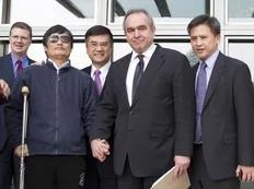 A handout photo from US Embassy Beijing Press office shows blind activist Chen Guangcheng (2nd L) shaking hands with U.S. Assistant Secretary of State for East Asian and Pacific Affairs Kurt Campbell (2nd R) as they stand with U.S. Ambassador to China Gary Locke (C), in Beijing, May 2, 2012...