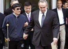 In this photo released by the US Embassy Beijing Press Office, blind lawyer Chen Guangcheng, left, is helped  by U.S. Assistant Secretary of State for East Asia and Pacific Affairs Kurt Campbell, right, and U.S. Ambassador to China Gary Locke as they leave the U.S. Embassy for a hospital...