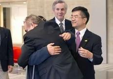 In this photo released by the US Embassy Beijing Press Office, blind lawyer Chen Guangcheng, obscured, is embraced by U.S. Assistant Secretary of State for East Asia and Pacific Affairs Kurt Campbell, as U.S. Ambassador to China Gary Locke, right, looks on, before leaving the U.S. Embassy...