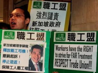 labour union activists protest outside their offices Singapore Consulate in Hong Kong December5,2012.