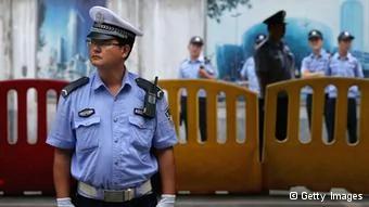 JINAN, CHINA- AUGUST25: Chinese policemen guard outside the Jinan Intermediate People