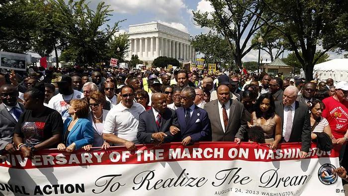 Rev. Al Sharpton links arms with Rep. John Lewis(D-GA), as they are joined by other civil rights activists and politicians to march during the50th anniversary of the1963 March on Washington for Jobs and Freedom at the Lincoln Memorial in Washington August24,2013.Thousands of marchers were expected in Washington, D.C. on Saturday to commemorate the50th anniversary of the Rev. Martin Luther King Jr.