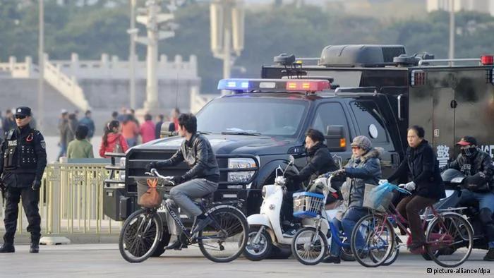 ©Kyodo/MAXPPP-30/10/2013; BEIJING, China- A police officer(L) stands guard in front of Beijing
