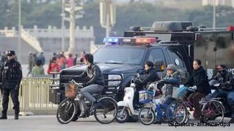 ©Kyodo/MAXPPP-30/10/2013; BEIJING, China- A police officer(L) stands guard in front of Beijing
