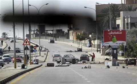 An impromptu roadblock is seen through a car windscreen in Tripoli, Libya, February 26, 2011