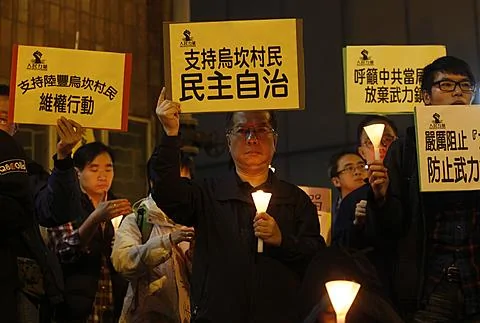 图为香港民众12月20日举行支持乌坎村民的抗议活动资料照
