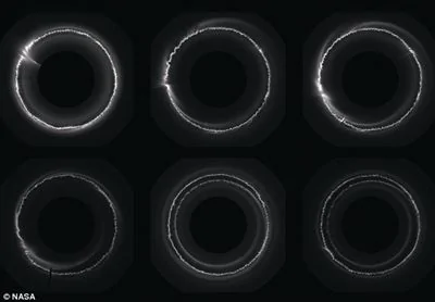 卫星照片显示土星光环被数百个不明物体击穿(组图)