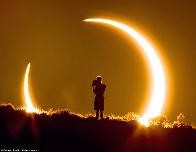 时机完美 一张令人惊叹的小孩看日食照片(高清组图)