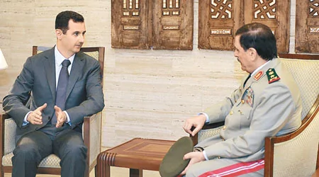 国营电视台前日播出阿萨德（左）会见新任防长弗拉杰（右）片段。 （美联社图片）