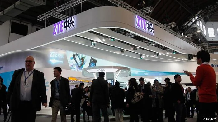 People visit the ZTE's booth at the Mobile World Congress in Barcelona February 27, 2012. The GSMA Mobile World Congress, representing the interests of the worldwide mobile communications industry, will take place from February 27 to March 1 in Barcelona. REUTERS/Albert Gea (SPAIN - Tags: SCIENCE TECHNOLOGY BUSINESS TELECOMS)