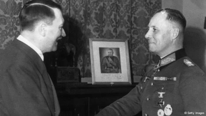 28th November 1942: Field marshal of the German African Corps Erwin Rommel (1891 - 1944) takes his leave of Adolf Hitler (1889 - 1945). A portrait of Mussolini appears in the background. (Photo by Keystone/Getty Images)