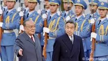 Chinese President Yang Shangkun(L) and Japanese Emperor Akihito review the honor guard in front of the Great Hall of the People in Beijing,23 October1992. Akihito arrived in China23 October1992, to mark the20th anniversary of Sino-Japanese diplomatic relations.(Photo credit should read MIKE FIALA/AFP/GettyImages)