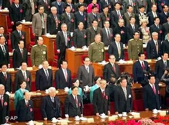 China's top leaders stand for the national anthem during the closing ceremony of the Chinese People's Political Consultative Conference in Beijing's Great Hall of the People Friday March14,2003. In the second row from left are Politburo Standing Committee member Huang Ju, Vice Premier Wen Jiabao, Vice Premier Li Lanqing, Li Ruihuan, who was replaced as CPPCC Chairman Thursday, National People's Congress Chairman Li Peng, President Jiang Zemin, Vice President and Communist Party Chief Hu Jintao, and Premier Zhu Rongji.(AP Photo/Greg Baker)