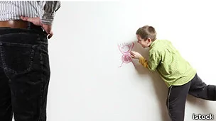 a boy drawing on the wall, istock