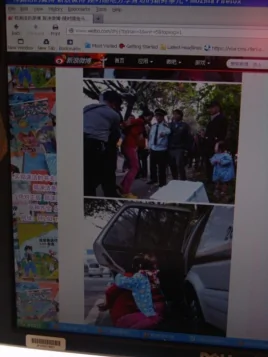 由南都报记者拍摄的广州城管与女商贩冲突的照片在网络流传。这是童话大王郑渊洁在个人微博上转发的图片。