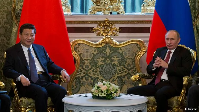 Russia's President Vladimir Putin(R) meets with his Chinese counterpart Xi Jinping at the Kremlin in Moscow March22,2013. REUTERS/Alexander Zemlianichenko/Pool(RUSSIA- Tags: POLITICS)
