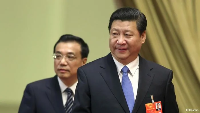 Xi Jinping(front), general secretary of the Central Committee of the Communist Party of China(CPC), and Li Keqiang, a member of the Standing Committee of the Political Bureau of the CPC Central Committee and Vice Premier, arrive at the third plenary meeting of the first session of the12th National People's Congress(NPC) held at the Great Hall of the People in Beijing March10,2013. Picture taken March10,2013. REUTERS/China Daily(CHINA- Tags: POLITICS) CHINA OUT. NO COMMERCIAL OR EDITORIAL SALES IN CHINA