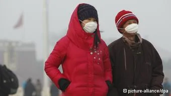 Pedestrians wearing masks walk on the Tiananmen Square in smog in Beijing, China,23 January2013. Air pollution spiked to dangerous levels again in Beijing yesterday, with skyscrapers vanishing amid the acrid smog and facial masks becoming so common they look like a new fashion trend. Local weather authorities issued yellow alerts for both fog and smog- the third-highest level on a four-tier colour-coded warning system- indicating that visibility could drop below500 meters, Xinhua reported. By4pm, the air pollution index in central Beijing exceeded300, which the government rates as hazardous, and an air monitoring station near a flyover in the Xicheng district recorded a level of423. A hazardous level over a24-hour period is considered bad enough to make even healthy people ill.
