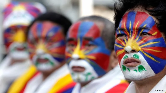 Activists with the colours of the Tibetan flag painted on their faces take part in a rally to support Tibet in Taipei March10,2013. Hundreds of Tibetans and their supporters in Taiwan marched the streets to commemorate the uprising in Lhasa54 years ago against Chinese rule. REUTERS/Pichi Chuang(TAIWAN- Tags: POLITICS CIVIL UNREST ANNIVERSARY TPX IMAGES OF THE DAY)