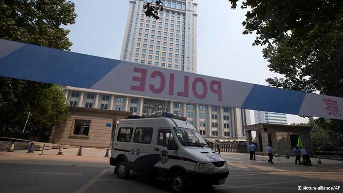 A police van drives past the Jinan Intermediate People's Court in Jinan, eastern China's Shandong province on Friday, Aug.23,2013. Former Chinese politician Bo Xilai's trial on charges of bribery, embezzlement and abuse of power enters its second day.(AP Photo/Ng Han Guan)