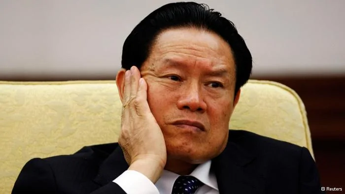Then China's Public Security Minister Zhou Yongkang reacts as he attends the Hebei delegation discussion sessions at the17th National Congress of the Communist Party of China at the Great Hall of the People, in Beijing October16,2007. Few figures are as divisive in China as former domestic security tsar Zhou, reportedly under investigation by the ruling Communist Party for corruption. Even the once ambitious but now ousted politician Bo Xilai, whose trial on corruption ended on August26,2013, doesn't evoke the same depth of feeling that Zhou does. From the oil fields of frigid northeastern China, the hulking Zhou worked his way up to the elite Politburo Standing Committee, where his spending on domestic security exceeded the separate budgets for defence, healthcare or education. Picture taken October16,2007. To match story CHINA-POLITICS/ZHOU REUTERS/Jason Lee(CHINA- Tags: POLITICS CRIME LAW)