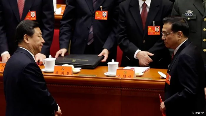 China's Vice President Xi Jinping(front L) and China's Vice-Premier Li Keqiang(front R) leave their seats after the closing session of18th National Congress of the Communist Party of China at the Great Hall of the People in Beijing, November14,2012. China's Communist Party congress offered the first clues on a generational leadership change on Wednesday as Xi Jinping and Li Keqiang took the first step to the presidency and premiership, respectively. The2,270 carefully vetted delegates cast their votes behind closed doors in Beijing's cavernous Great Hall of the People for the new Central Committee, a ruling council with around200 full members and170 or so alternate members with no voting rights. REUTERS/Jason Lee(CHINA- Tags: POLITICS)