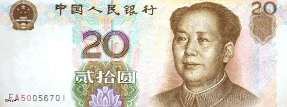 ** ADVANCE FOR TUESDAY, DEC.26** A bank clerk shows a new20 renminbi(then2.40 U.S. dollars) note, bearing a portrait of Mao Zedong, founder of the People's Republic of China, Oct.20,2000 at Bank of China in Shanghai. The new note started circulating Oct.16 officially to replace old1 and2 renminbi notes. Was Mao a monster or an authentic Chinese hero? Historians, journalists and many Chinese are still pondering these questions at the113th anniversary of the birth of Mao, father of communist China. Mao was born on Dec.26,1893.(AP Photo/Eugene Hoshiko)