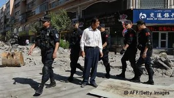 GettyImages171834907
Chinese armed police patrol the streets of the Muslim Uighur quarter in Urumqi on June29,2013 after a series of recent terrorist attacks hit the Xinjiang region. China's state-run media on June29 blamed around100 people it branded as'terrorists' for sparking'riots' in the ethnically-divided region of Xinjiang, where clashes killed35 two days earlier. AFP PHOTO/ Mark RALSTON(Photo credit should read MARK RALSTON/AFP/Getty Images)