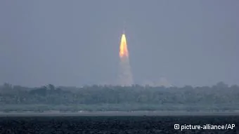 The Polar Satellite Launch Vehicle(PSLV-C25) rocket lifts off carrying India's Mars spacecraft from the east coast island of Sriharikota, India, Tuesday, Nov.5,2013. India on Tuesday launched its first spacecraft bound for Mars, a complex mission that it hopes will demonstrate and advance technologies for space travel. The1,350-kilogram(3,000-pound) Mangalyaan orbiter was headed first into an elliptical orbit around Earth, after which a series of technical maneuvers and short burns will raise its orbit before it slingshots toward Mars.(AP Photo/Arun Sankar K)