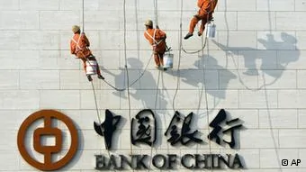 Chinese workers scale the wall near the logo for the Bank of China Ltd., China's second biggest commercial bank in Beijing, China, Monday, Oct.2,2006. China's banks have seen revenues soar amid double-digit growth in lending despite government efforts to cool off an economy that expanded by11.3 percent in the second quarter. Bankers are racing to modernize operations as Beijing prepares to meet a Dec.11 deadline for fully opening their market to foreign competitors under World Trade Organization commitments.(ddp images/AP Photo/Ng Han Guan)