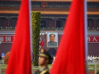 Soldiers from the honour guards of the Chinese People's Liberation Army(PLA) line up against a backdrop of a portrait of late chairman Mao Zedong hanging on the Tiananmen Gate, during a welcoming ceremony for Kuwait's Prime Minister Sheikh Jaber al-Mubara