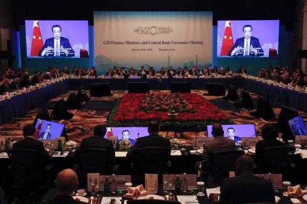 Chinese Premier Li Keqiang delivers a message relayed on video screens to delegates at the G20 Finance Ministers and Central Bank Governors Meeting in Shanghai on February26,2016. Germany is against the world's top20 economies launching a fiscal stimulus package in the face of slowing global growth, its finance minister said February26, as the major powers disagreed on the best approach. AFP PHOTO/ ROLEX DELA PENA/ POOL/ AFP/ POOL/ ROLEX DELA PENA