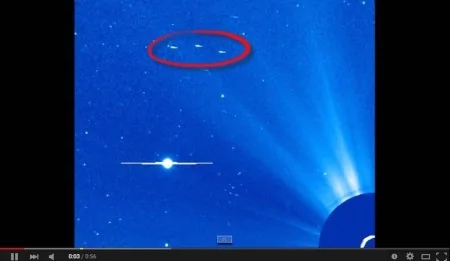 UFO探索者Streetcap1在SOHO圖像中發現UFO編隊飛過太陽。（視頻截圖）