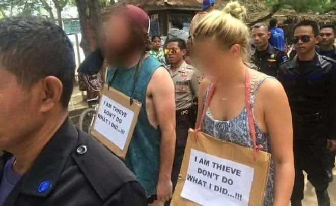 观光客在印尼被挂上狗牌游街示众