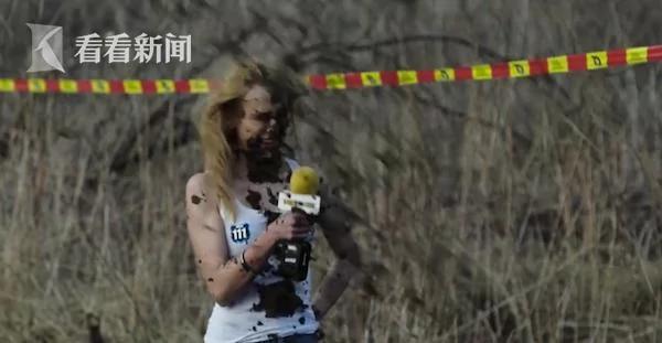 囧!美女记者优雅采访摩托车手 被甩一脸泥!